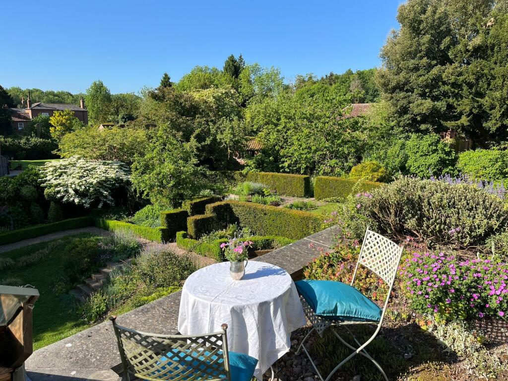 The hidden roof terrace enjoys sunny secret views over the walled garden