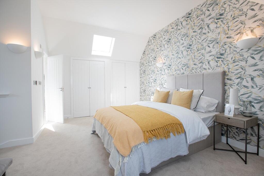 A king-size bedroom with fitted wardrobes