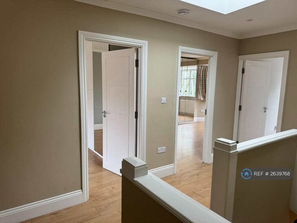 Bright Upstairs Hallway Lit With a Skylight
