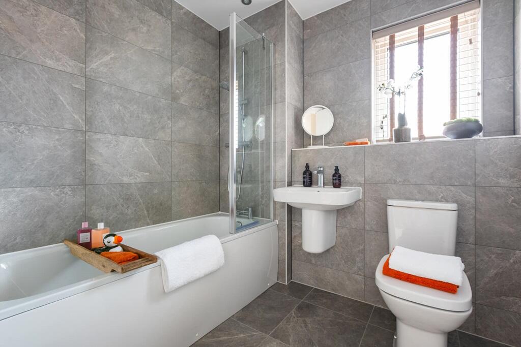 A generous family bathroom completes this home