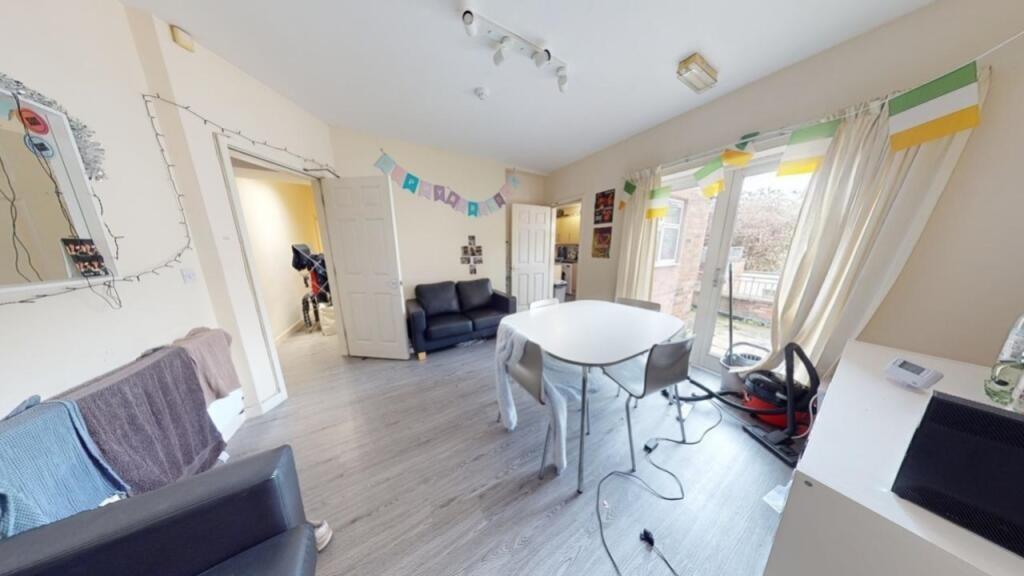 Bright and spacious living room with modern flo...