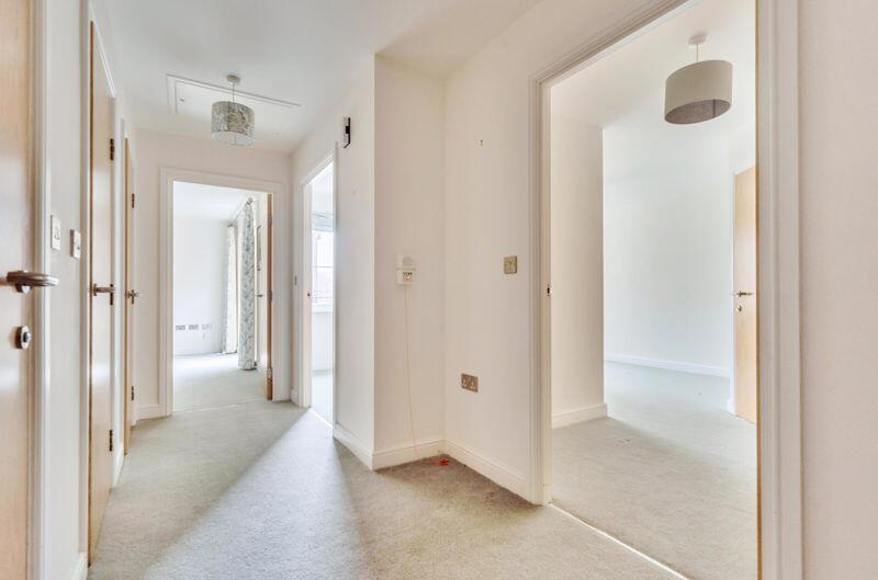 Hallway with storage cupboards