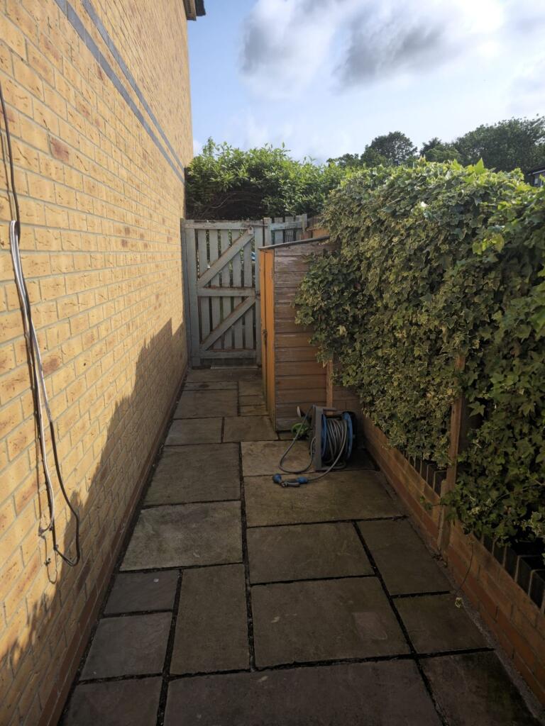A neat side passageway adjacent to the property...