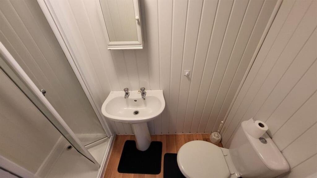 A neat and well-maintained bathroom featuring a...