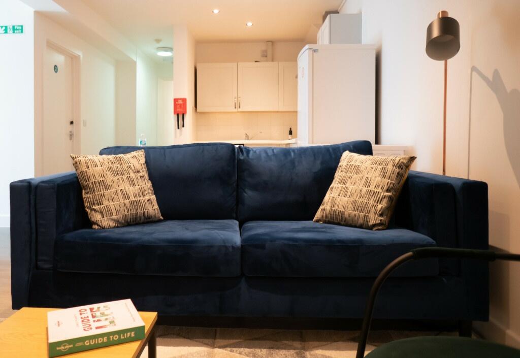 A spacious and modern living room with a large,...