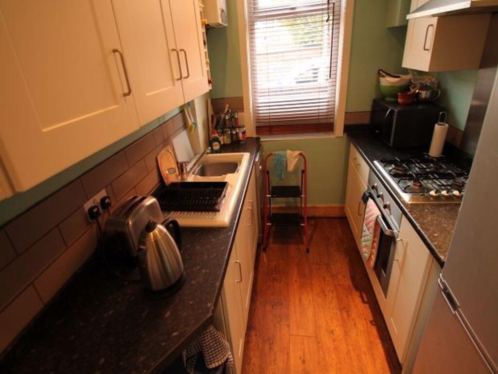 Bright and well-maintained kitchen with modern ...