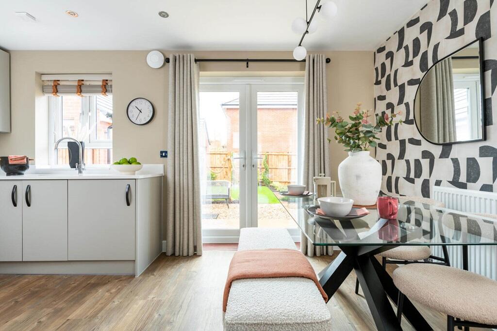 Double doors lead from the dining area to the garden