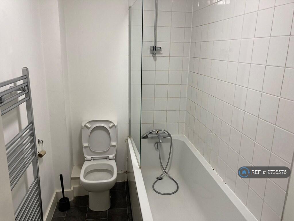 Bathroom With Bath Overhead Shower &amp; Toilet 