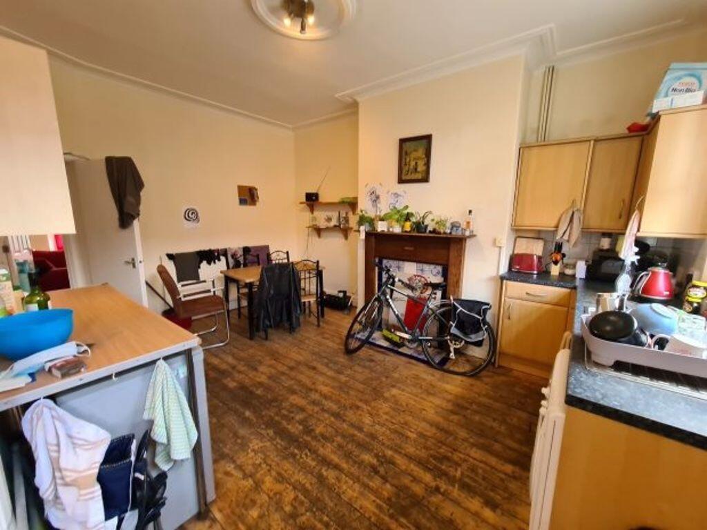 A warm and inviting kitchen space featuring woo...