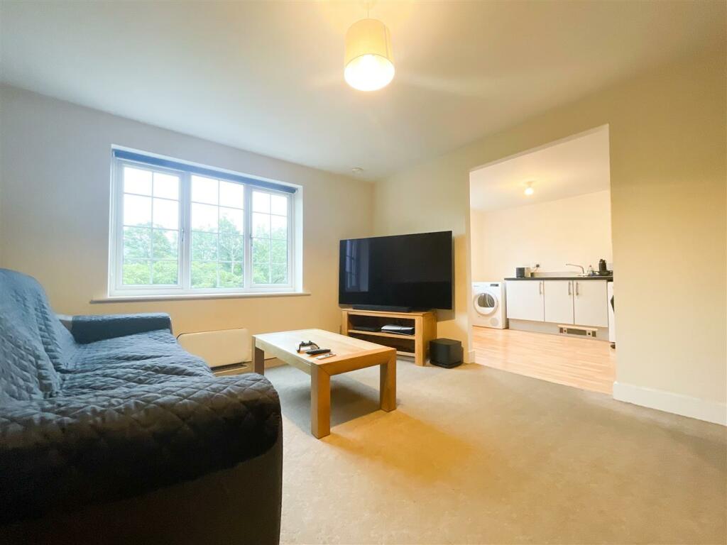 LOUNGE THROUGH TO KITCHEN