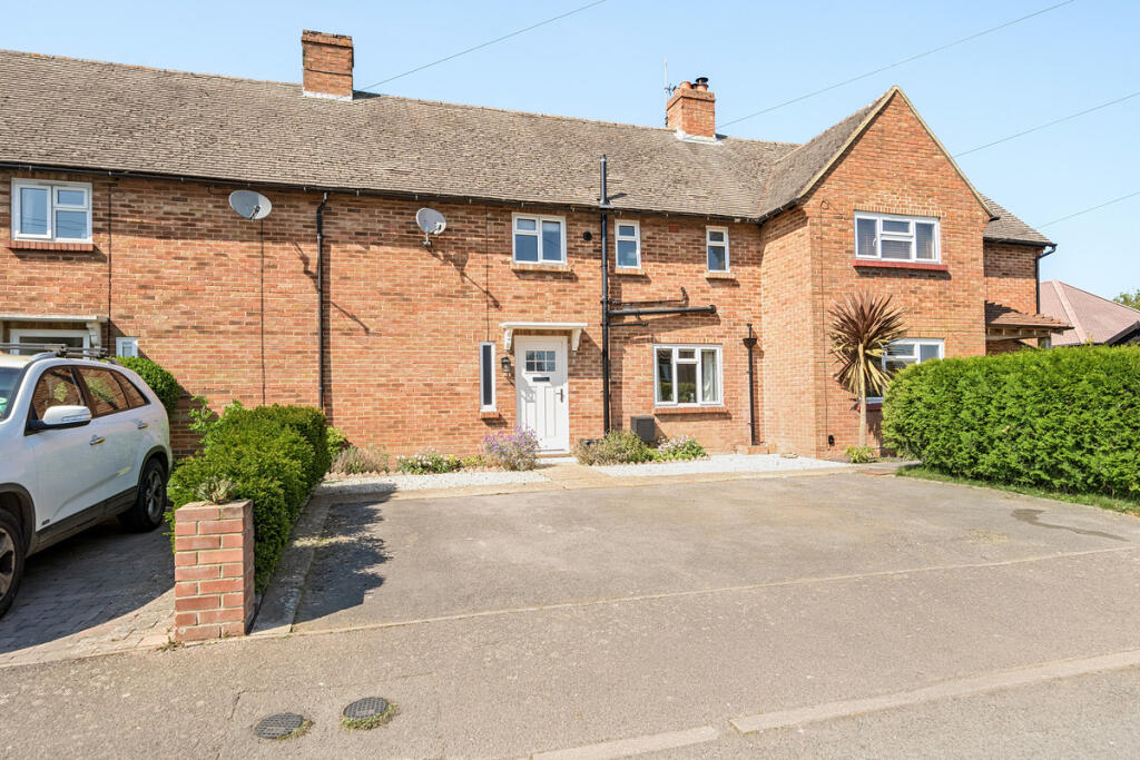 Front elevation with driveway providing off road parking for three vehicles
