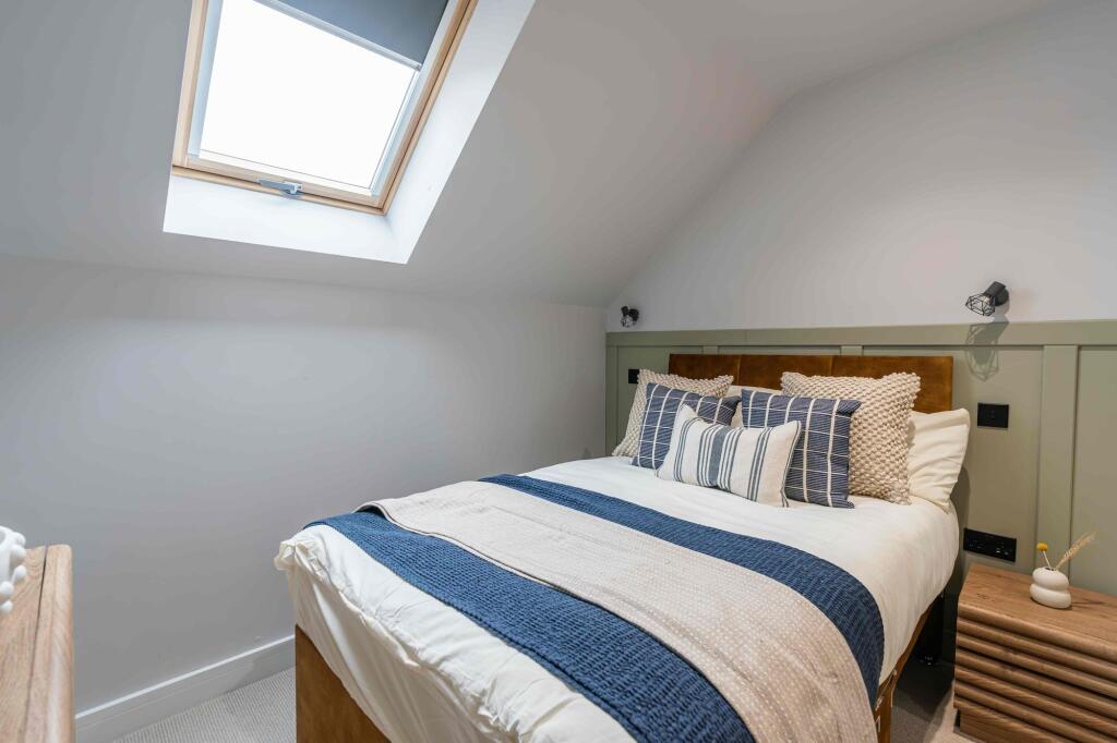 Bright and inviting master bedroom featuring a ...