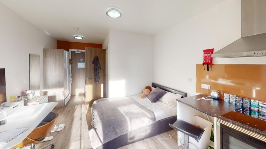 A bright and inviting double bedroom featuring ...
