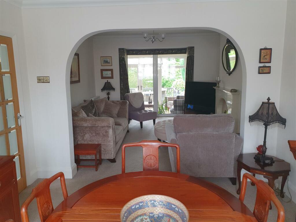 SEPARATE BUT ADJOINING LOUNGE AND DINING ROOM