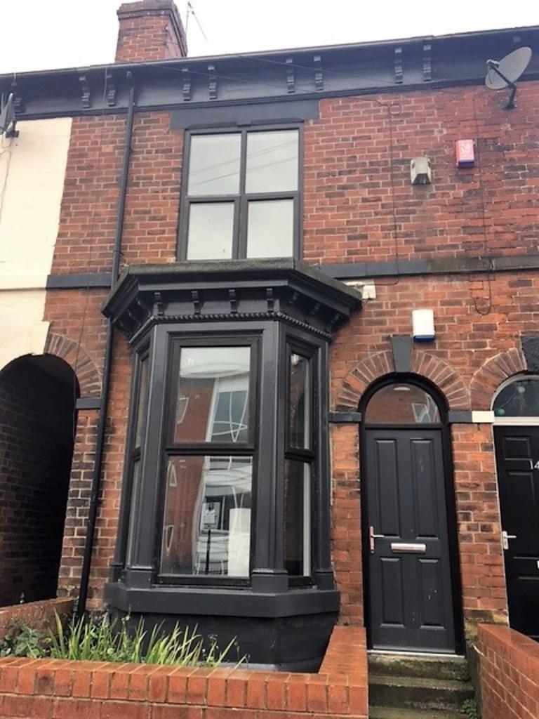 Charming terraced brick house featuring a class...