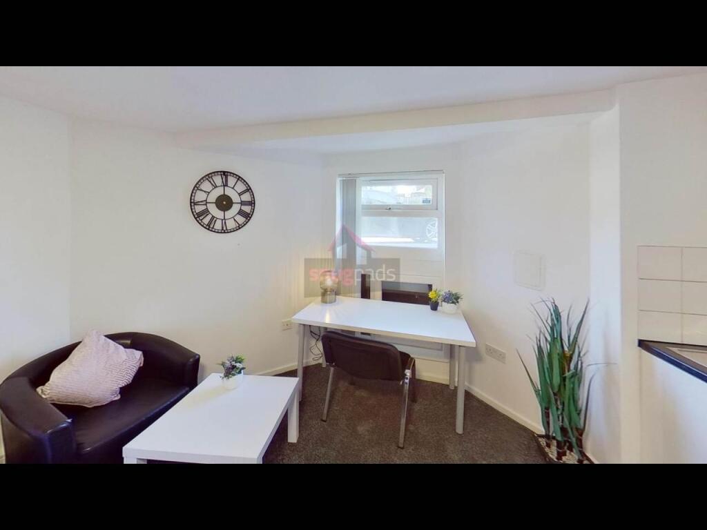 Bright and welcoming living room with a comfort...