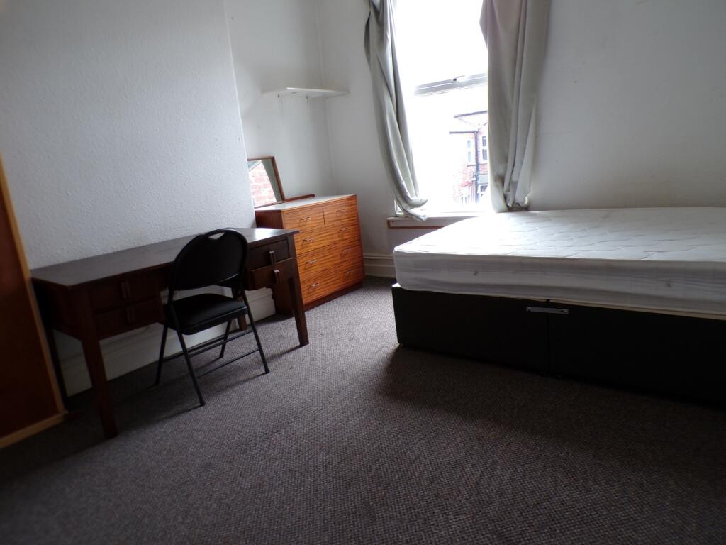 A spacious and well-lit double bedroom ideal fo...