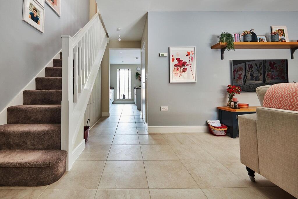 The large hallway leads into the open layout of the ground floor