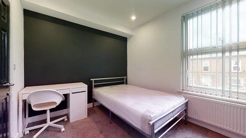 Bright and modern double bedroom featuring a co...