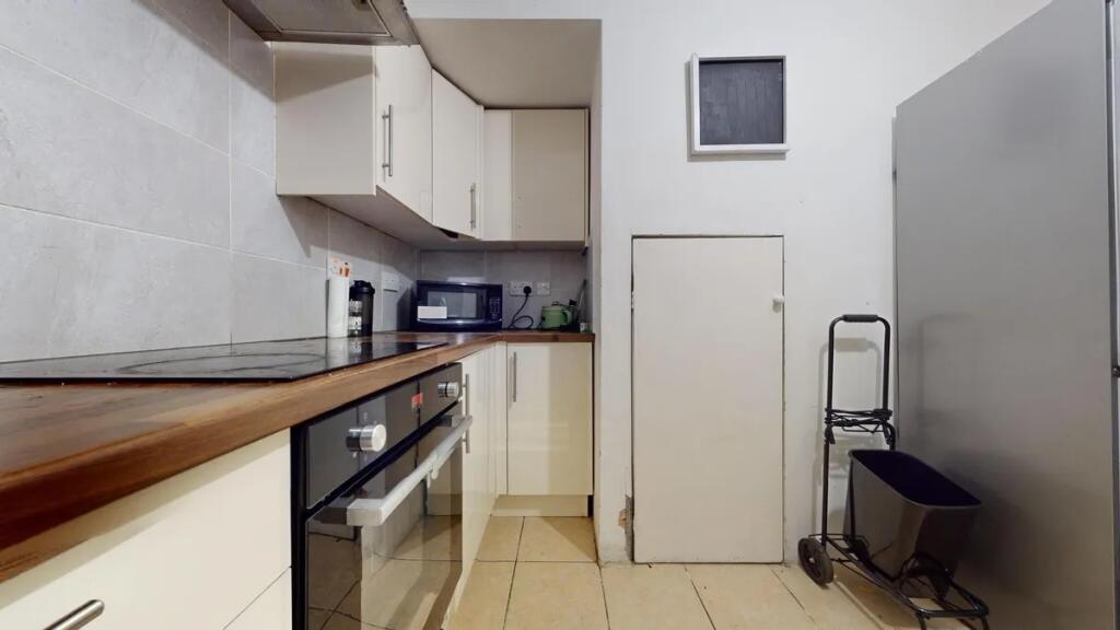 Modern kitchen featuring a sleek electric hob a...
