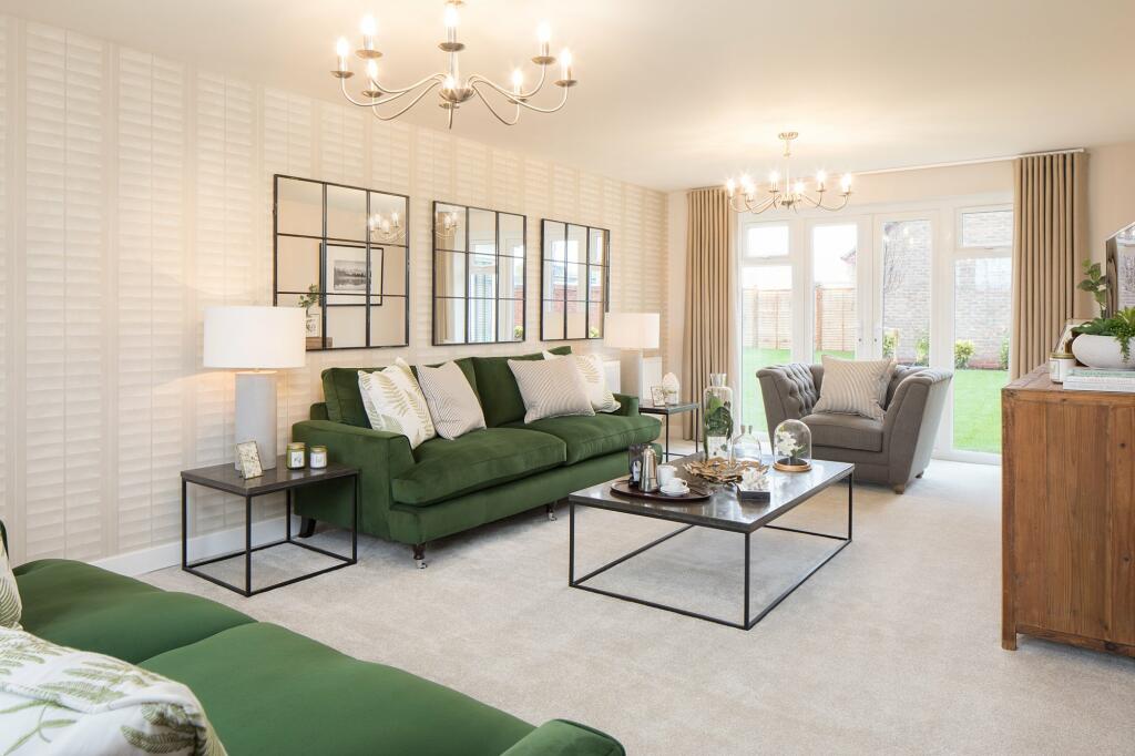 Spacious bay-fronted lounge with French doors onto the garden