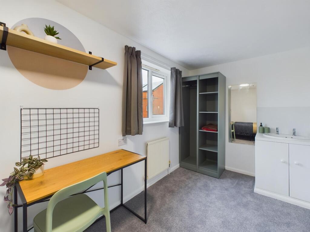 A bright and modern double bedroom featuring a ...