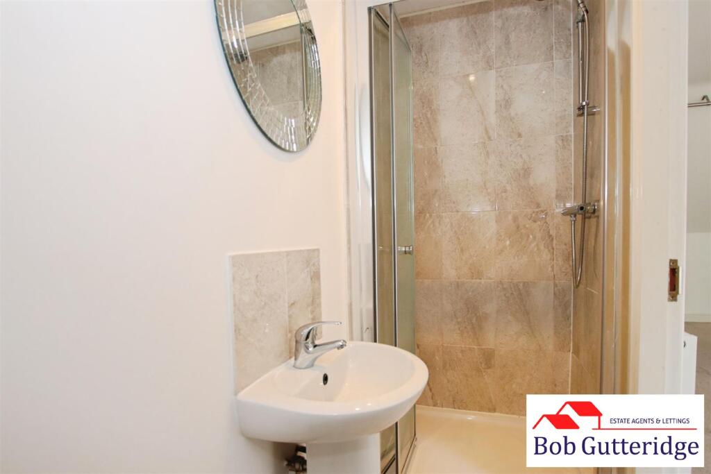 EN-SUITE SHOWER ROOM