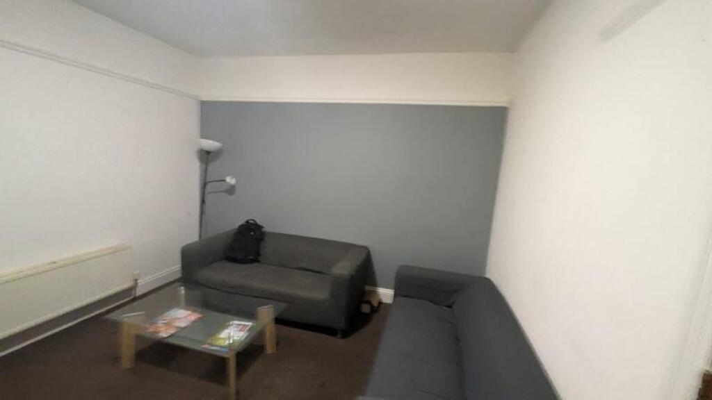 A cozy living room with comfortable seating, pe...