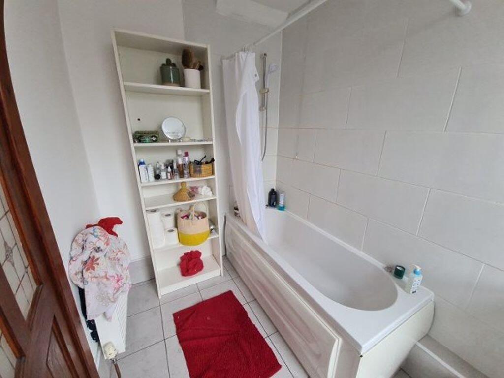 A clean and modern bathroom featuring a spaciou...