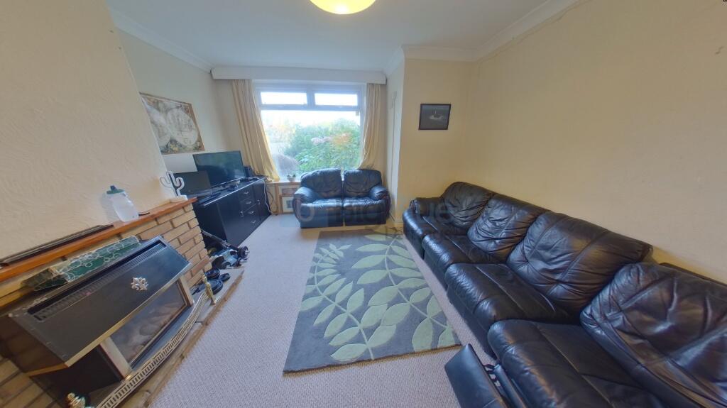 A cozy living room featuring comfortable leathe...