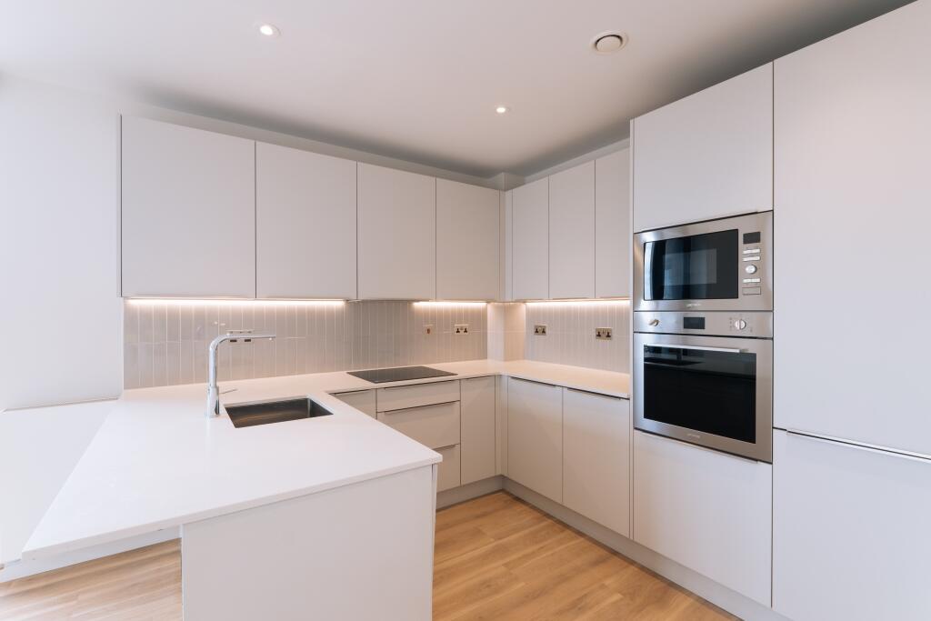 Explore this modern kitchen space that blends style and functionality effortlessly.