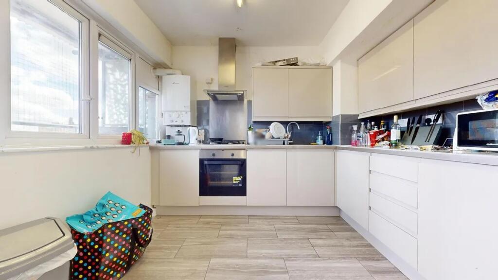 Bright and modern kitchen space featuring ample...