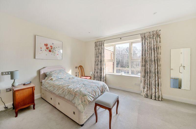 Master bedroom with fitted wardrobe a...