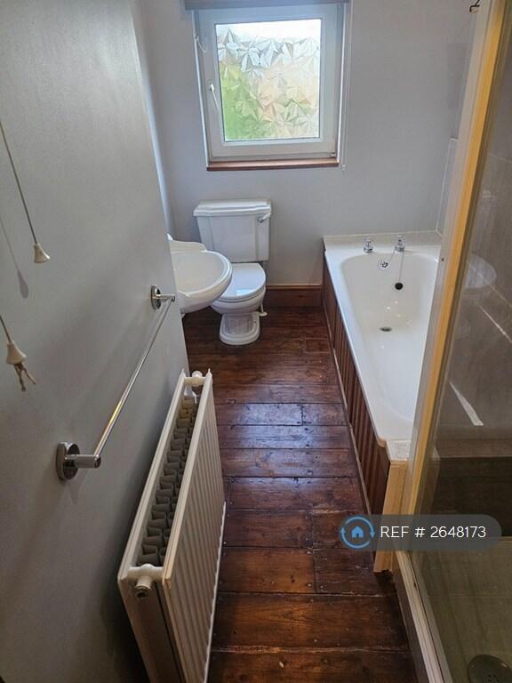 Bathroom. Sink, Toilet, Bath And Electric Shower