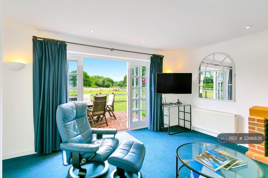 Lounge French Windows Open Onto Patio