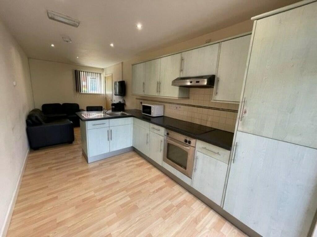 Contemporary kitchen with ample cabinet space, ...