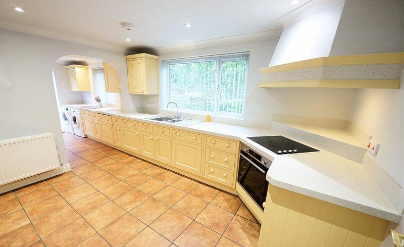 Kitchen leading to the utility room