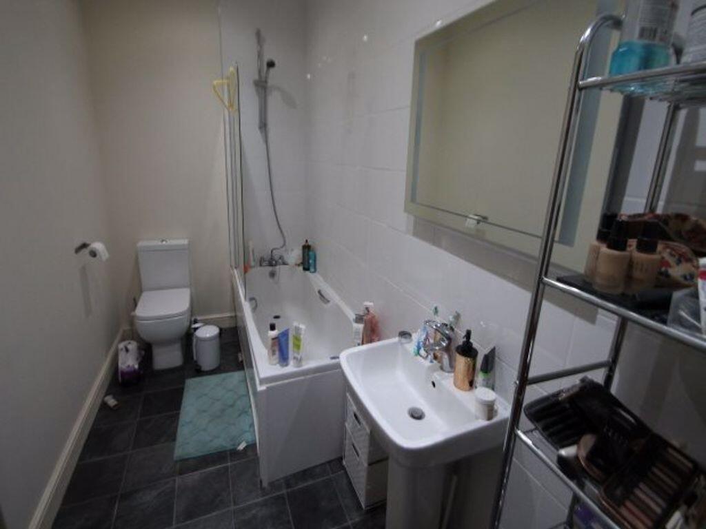 A clean and well-maintained bathroom featuring ...