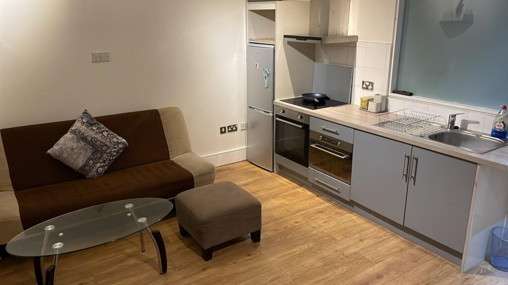 A modern kitchenette featuring sleek appliances...