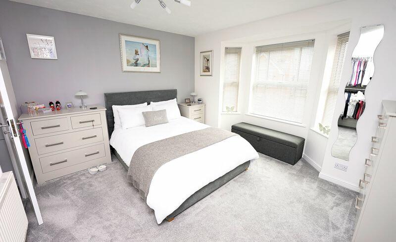 Principal bedroom leading to an en suite