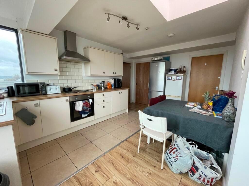 Bright and functional kitchen space featuring m...