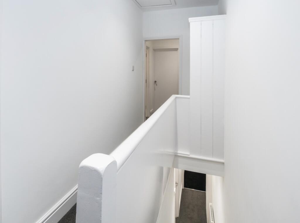 A clean and bright hallway, providing a welcomi...