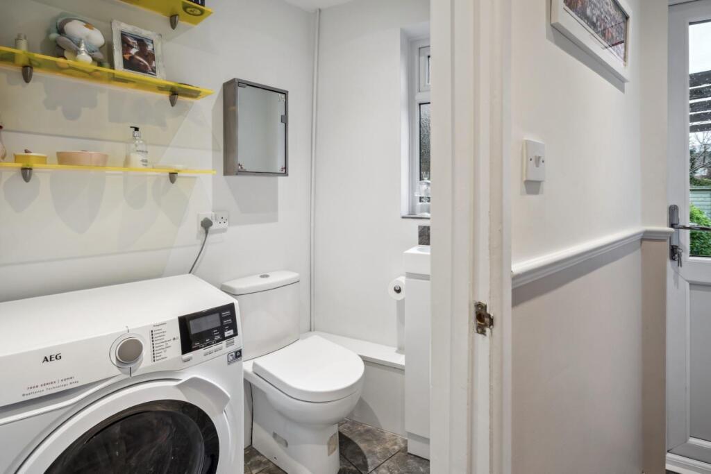 GUEST CLOAKROOM/UTILITY AREA