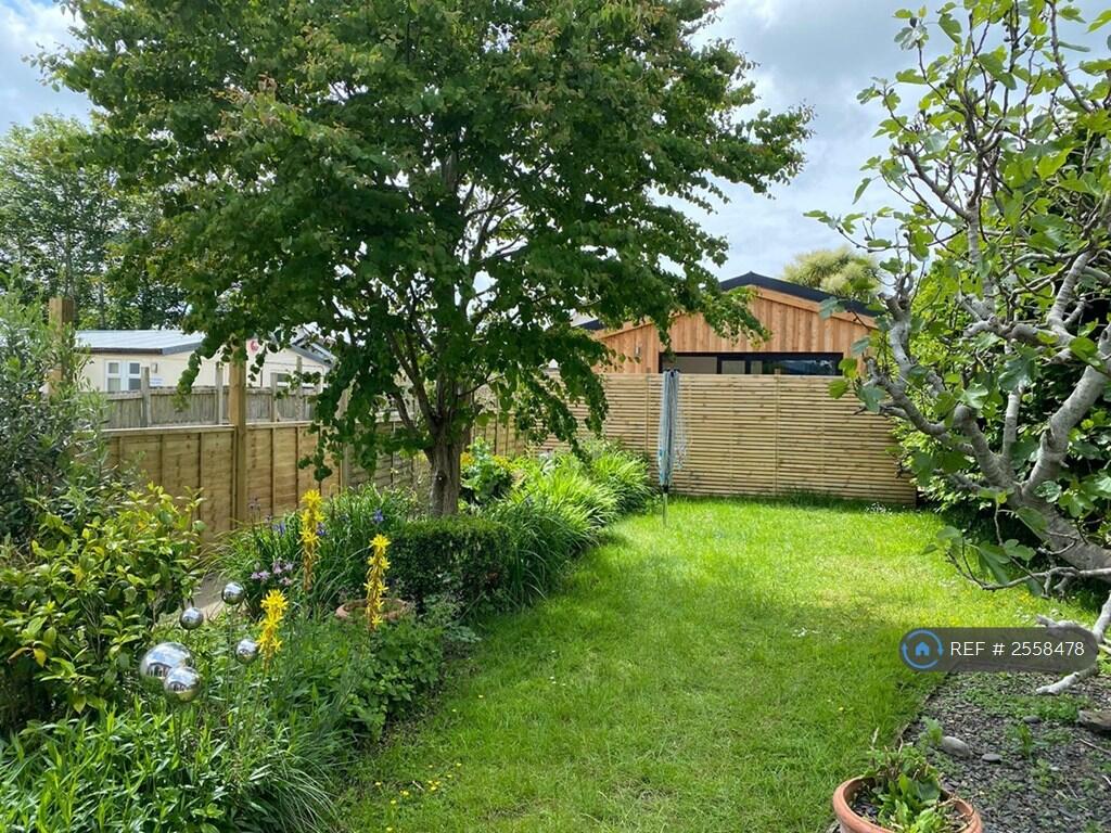 Garden With Cabin At End