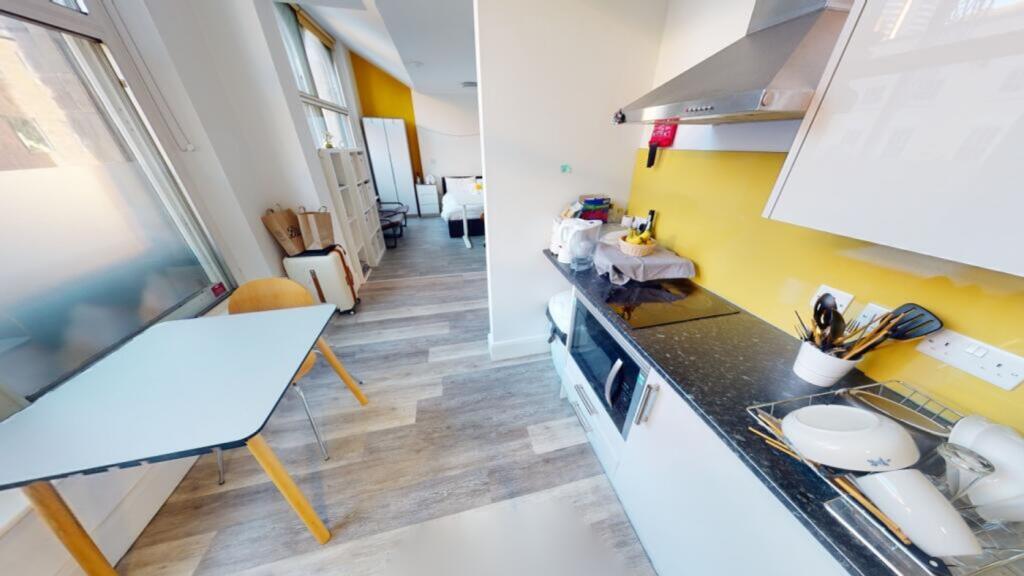 Bright and modern kitchen featuring sleek count...