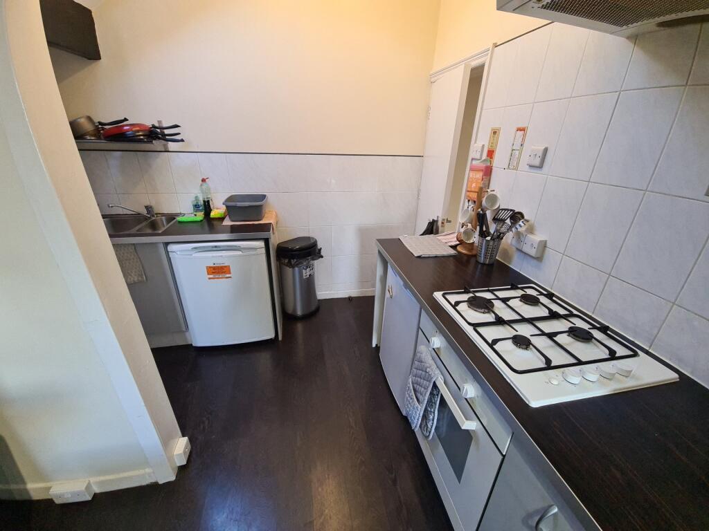A compact but functional kitchen area with a cl...