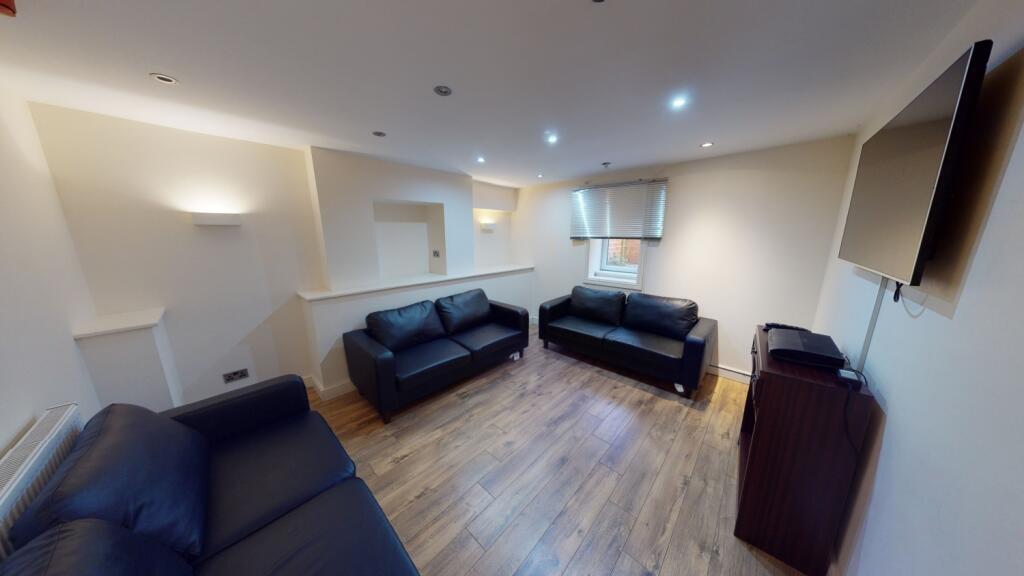 A comfortable communal lounge featuring three b...
