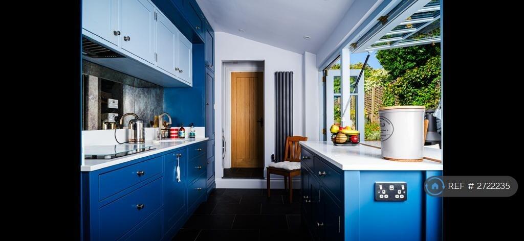 Kitchen Looking To The Utility And Bathroom Door.