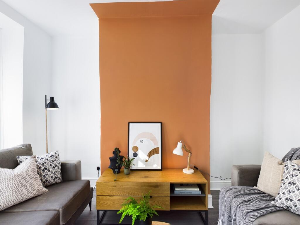 A spacious and stylish modern living room with ...
