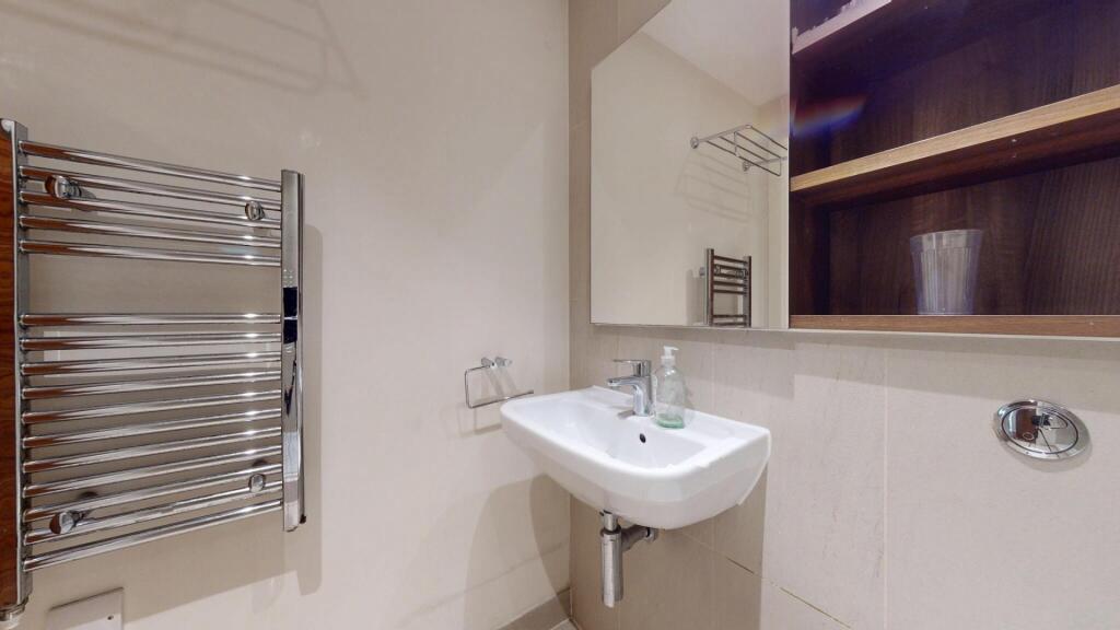 A modern, well-maintained bathroom featuring a ...